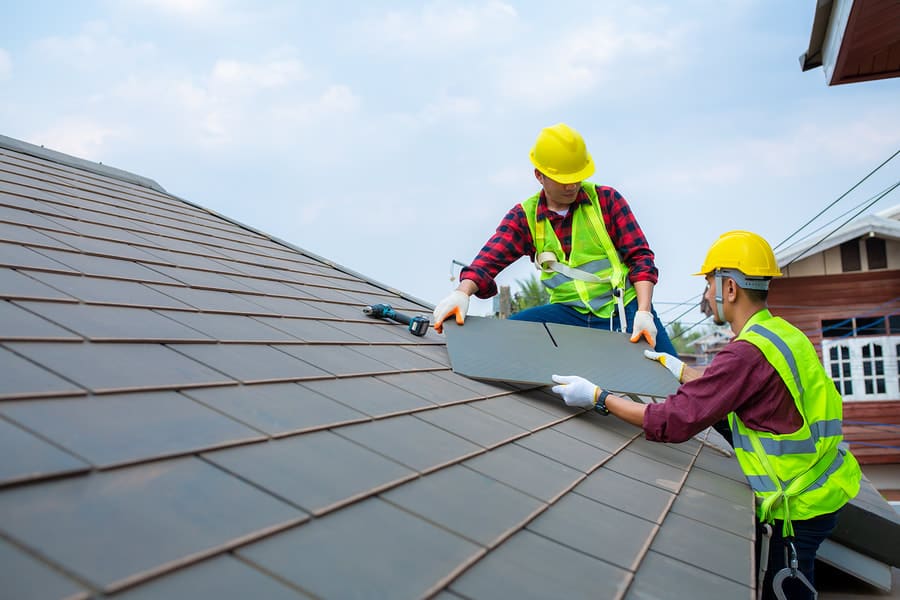 Roofing crew installing a roof