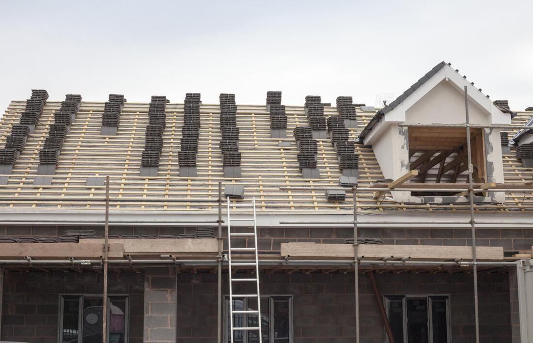 Roof work in progress with scaffolding